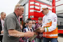 Paul di Resta (GBR) Sahara Force India F1 signs autographs for the fans. 27.06.2013. Formula 1 World Championship, Rd 8, British Grand Prix, Silverstone, England, Preparation Day.