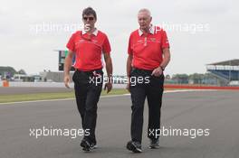 (L to R): Graeme Lowdon (GBR) Marussia F1 Team Chief Executive Officer and John Booth (GBR) Marussia F1 Team Team Principal walk the circuit. 27.06.2013. Formula 1 World Championship, Rd 8, British Grand Prix, Silverstone, England, Preparation Day.