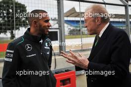 Lewis Hamilton (GBR) Mercedes AMG F1 with Sir David Frost (GBR) Broadcaster. 27.06.2013. Formula 1 World Championship, Rd 8, British Grand Prix, Silverstone, England, Preparation Day.