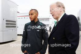 (L to R): Lewis Hamilton (GBR) Mercedes AMG F1 with Sir David Frost (GBR). 27.06.2013. Formula 1 World Championship, Rd 8, British Grand Prix, Silverstone, England, Preparation Day.