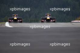 (L to R): Sebastian Vettel (GER) Red Bull Racing RB9 and Mark Webber (AUS) Red Bull Racing RB9. 05.07.2013. Formula 1 World Championship, Rd 9, German Grand Prix, Nurburgring, Germany, Practice Day.