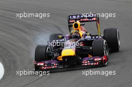 Sebastian Vettel (GER) Red Bull Racing RB9 locks up under braking. 05.07.2013. Formula 1 World Championship, Rd 9, German Grand Prix, Nurburgring, Germany, Practice Day.