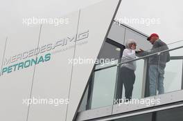 (L to R): Bernie Ecclestone (GBR) CEO Formula One Group (FOM) talks with Niki Lauda (AUT) Mercedes Non-Executive Chairman on the Mercedes AMG F1 motorhome roof. 05.07.2013. Formula 1 World Championship, Rd 9, German Grand Prix, Nurburgring, Germany, Practice Day.