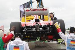 The Ferrari F138 of Fernando Alonso (ESP) Ferrari is recovered back to the pits on the back of a truck after he stopped in the first practice session. 05.07.2013. Formula 1 World Championship, Rd 9, German Grand Prix, Nurburgring, Germany, Practice Day.