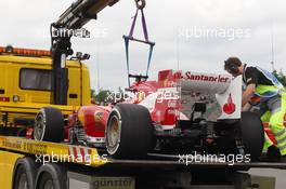 The Ferrari F138 of Fernando Alonso (ESP) Ferrari is recovered back to the pits on the back of a truck after he stopped in the first practice session. 05.07.2013. Formula 1 World Championship, Rd 9, German Grand Prix, Nurburgring, Germany, Practice Day.