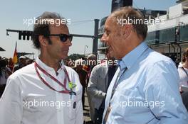 (L to R): Emanuele Pirro (ITA) FIA Steward with Hans-Joachim Stuck (GER) on the grid. 07.07.2013. Formula 1 World Championship, Rd 9, German Grand Prix, Nurburgring, Germany, Race Day.