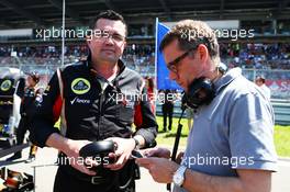 (L to R): Eric Boullier (FRA) Lotus F1 Team Principal with Eric Lux (BEL) Genii Capital CEO on the grid. 07.07.2013. Formula 1 World Championship, Rd 9, German Grand Prix, Nurburgring, Germany, Race Day.