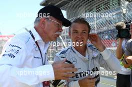 (L to R): Dr. Dieter Zetsche (GER) Daimler AG CEO with Nico Rosberg (GER) Mercedes AMG F1 on the grid. 07.07.2013. Formula 1 World Championship, Rd 9, German Grand Prix, Nurburgring, Germany, Race Day.