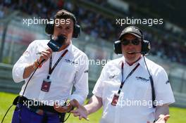 (L to R): Will Buxton (GBR) NBS Sports Network TV Presenter with Jason Swales (GBR) NBC Sports Network on the grid. 07.07.2013. Formula 1 World Championship, Rd 9, German Grand Prix, Nurburgring, Germany, Race Day.