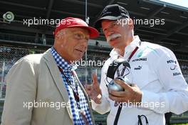 (L to R): Niki Lauda (AUT) Mercedes Non-Executive Chairman with Dr. Dieter Zetsche (GER) Daimler AG CEO on the grid. 07.07.2013. Formula 1 World Championship, Rd 9, German Grand Prix, Nurburgring, Germany, Race Day.