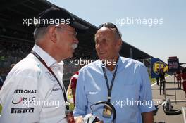 (L to R): Dr. Dieter Zetsche (GER) Daimler AG CEO with Hans-Joachim Stuck (GER) on the grid. 07.07.2013. Formula 1 World Championship, Rd 9, German Grand Prix, Nurburgring, Germany, Race Day.