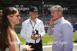 Dr. Dieter Zetsche (GER) Daimler AG CEO (Centre) with David Coulthard (GBR) Red Bull Racing and Scuderia Toro Advisor / BBC Television Commentator (Right) on the grid. 07.07.2013. Formula 1 World Championship, Rd 9, German Grand Prix, Nurburgring, Germany, Race Day.