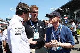 Toto Wolff (GER) Mercedes AMG F1 Shareholder and Executive Director (Left) and Ron Howard (USA) Film Director (Right) on the grid. 07.07.2013. Formula 1 World Championship, Rd 9, German Grand Prix, Nurburgring, Germany, Race Day.