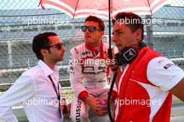 Jules Bianchi (FRA) Marussia F1 Team with Nicolas Todt (FRA) Driver Manager on the grid. 07.07.2013. Formula 1 World Championship, Rd 9, German Grand Prix, Nurburgring, Germany, Race Day.