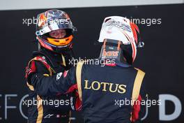 (L to R): Romain Grosjean (FRA) Lotus F1 Team and Kimi Raikkonen (FIN) Lotus F1 Team celebrate in parc ferme. 07.07.2013. Formula 1 World Championship, Rd 9, German Grand Prix, Nurburgring, Germany, Race Day.