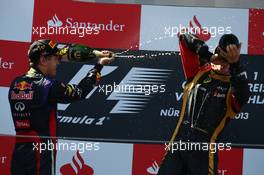 1st place Sebastian Vettel (GER) Red Bull Racing and 2nd place Kimi Raikkonen (FIN) Lotus F1 E21. 07.07.2013. Formula 1 World Championship, Rd 9, German Grand Prix, Nurburgring, Germany, Race Day.