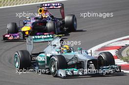 Lewis Hamilton (GBR) Mercedes AMG F1 W04 leads Sebastian Vettel (GER) Red Bull Racing RB9. 07.07.2013. Formula 1 World Championship, Rd 9, German Grand Prix, Nurburgring, Germany, Race Day.