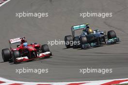Fernando Alonso (ESP) Ferrari F138 and Lewis Hamilton (GBR) Mercedes AMG F1 W04 battle for position. 07.07.2013. Formula 1 World Championship, Rd 9, German Grand Prix, Nurburgring, Germany, Race Day.