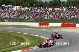 Jules Bianchi (FRA) Marussia F1 Team MR02 leads Mark Webber (AUS) Red Bull Racing RB9. 07.07.2013. Formula 1 World Championship, Rd 9, German Grand Prix, Nurburgring, Germany, Race Day.