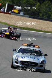 Sebastian Vettel (GER) Red Bull Racing RB9 leads behind the FIA Safety Car. 07.07.2013. Formula 1 World Championship, Rd 9, German Grand Prix, Nurburgring, Germany, Race Day.