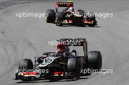 Kimi Raikkonen (FIN) Lotus F1 E21 leads Romain Grosjean (FRA) Lotus F1 E21. 07.07.2013. Formula 1 World Championship, Rd 9, German Grand Prix, Nurburgring, Germany, Race Day.