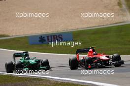 Max Chilton (GBR) Marussia F1 Team MR02 battles with Charles Pic (FRA) Caterham CT03. 07.07.2013. Formula 1 World Championship, Rd 9, German Grand Prix, Nurburgring, Germany, Race Day.
