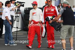 Fernando Alonso (ESP) Ferrari with Edoardo Bendinelli (ITA) Personal Trainer. 06.07.2013. Formula 1 World Championship, Rd 9, German Grand Prix, Nurburgring, Germany, Qualifying Day.