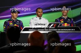 The top three qualifiers in the FIA Press Conference (L to R): Sebastian Vettel (GER) Red Bull Racing, second; Lewis Hamilton (GBR) Mercedes AMG F1, pole position; Mark Webber (AUS) Red Bull Racing, third.. 06.07.2013. Formula 1 World Championship, Rd 9, German Grand Prix, Nurburgring, Germany, Qualifying Day.