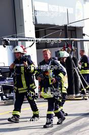 Firemen were called to the Williams garage after they suffered an incident with a KERS unit. 06.07.2013. Formula 1 World Championship, Rd 9, German Grand Prix, Nurburgring, Germany, Qualifying Day.