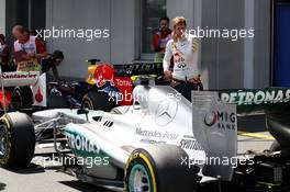 Sebastian Vettel (GER) Red Bull Racing RB9 takes a look at the Mercedes AMG F1 W04 of Lewis Hamilton (GBR) Mercedes AMG F1 in parc ferme. 06.07.2013. Formula 1 World Championship, Rd 9, German Grand Prix, Nurburgring, Germany, Qualifying Day.