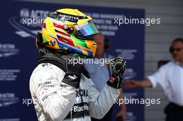 Lewis Hamilton (GBR) Mercedes AMG F1 celebrates his pole position in parc ferme. 06.07.2013. Formula 1 World Championship, Rd 9, German Grand Prix, Nurburgring, Germany, Qualifying Day.