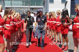 (L to R): Romain Grosjean (FRA) Lotus F1 Team and Jean-Eric Vergne (FRA) Scuderia Toro Rosso on the drivers parade. 07.07.2013. Formula 1 World Championship, Rd 9, German Grand Prix, Nurburgring, Germany, Race Day.