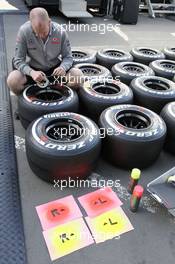 Pirelli tyres prepared by a McLaren mechanic. 04.07.2013. Formula 1 World Championship, Rd 9, German Grand Prix, Nurburgring, Germany, Preparation Day.