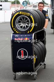 Pirelli tyres pushed by a Red Bull Racing mechanic. 04.07.2013. Formula 1 World Championship, Rd 9, German Grand Prix, Nurburgring, Germany, Preparation Day.