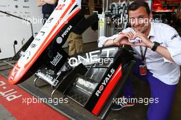 Will Buxton (GBR) NBS Sports Network TV Presenter enjoys the Reading FC branding on the Marussia F1 Team MR02 nosecone. 04.07.2013. Formula 1 World Championship, Rd 9, German Grand Prix, Nurburgring, Germany, Preparation Day.