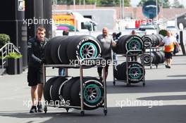 Pirelli tyres pushed on a trolley by a Mercedes AMG F1 mechanic. 04.07.2013. Formula 1 World Championship, Rd 9, German Grand Prix, Nurburgring, Germany, Preparation Day.