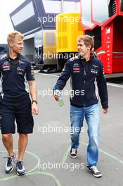 Heikki Huovinen (FIN) Personal Trainer (Left) with Sebastian Vettel (GER) Red Bull Racing. 04.07.2013. Formula 1 World Championship, Rd 9, German Grand Prix, Nurburgring, Germany, Preparation Day.