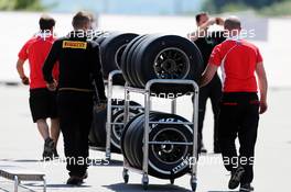 Marussia F1 Team mechanic with Pirelli tyres. 04.07.2013. Formula 1 World Championship, Rd 9, German Grand Prix, Nurburgring, Germany, Preparation Day.