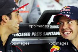 (L to R): Daniel Ricciardo (AUS) Scuderia Toro Rosso and Sebastian Vettel (GER) Red Bull Racing in the FIA Press Conference. 04.07.2013. Formula 1 World Championship, Rd 9, German Grand Prix, Nurburgring, Germany, Preparation Day.
