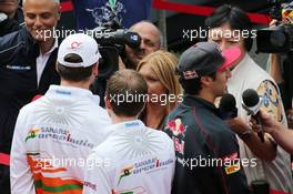 (L to R): Adrian Sutil (GER) Sahara Force India F1 and Daniel Ricciardo (AUS) Scuderia Toro Rosso with the media. 04.07.2013. Formula 1 World Championship, Rd 9, German Grand Prix, Nurburgring, Germany, Preparation Day.