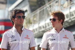 (L to R): Sergio Perez (MEX) McLaren with Oliver Turvey (GBR) McLaren Test Driver. 26.07.2013. Formula 1 World Championship, Rd 10, Hungarian Grand Prix, Budapest, Hungary, Practice Day
