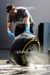 A Mercedes AMG F1 mechanic washes Pirelli tyres. 26.07.2013. Formula 1 World Championship, Rd 10, Hungarian Grand Prix, Budapest, Hungary, Practice Day