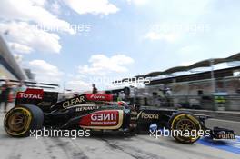 Kimi Raikkonen (FIN) Lotus F1 E21 leaves the pits. 26.07.2013. Formula 1 World Championship, Rd 10, Hungarian Grand Prix, Budapest, Hungary, Practice Day
