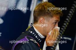 Sebastian Vettel (GER) Red Bull Racing blows his nose. 26.07.2013. Formula 1 World Championship, Rd 10, Hungarian Grand Prix, Budapest, Hungary, Practice Day