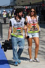 Nira Juanco (ESP) Antena 3 TV Presenter and her cameraman with the new Pit Lane Television Tabards. 26.07.2013. Formula 1 World Championship, Rd 10, Hungarian Grand Prix, Budapest, Hungary, Practice Day