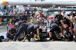 Sebastian Vettel (GER) Red Bull Racing RB9 practices a pit stop. 26.07.2013. Formula 1 World Championship, Rd 10, Hungarian Grand Prix, Budapest, Hungary, Practice Day