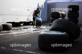 Mercedes AMG F1 mechanics wash Pirelli tyres. 26.07.2013. Formula 1 World Championship, Rd 10, Hungarian Grand Prix, Budapest, Hungary, Practice Day