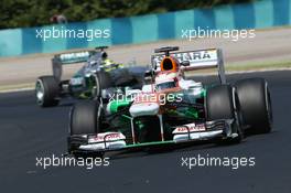 Paul di Resta (GBR) Sahara Force India VJM06 leads Nico Rosberg (GER) Mercedes AMG F1 W04. 26.07.2013. Formula 1 World Championship, Rd 10, Hungarian Grand Prix, Budapest, Hungary, Practice Day