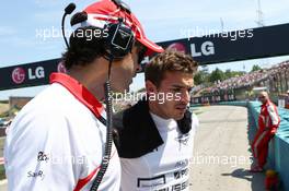Jules Bianchi (FRA) Marussia F1 Team with Marc Hynes (GBR) Marussia F1 Team Driver Coach on the grid. 28.07.2013. Formula 1 World Championship, Rd 10, Hungarian Grand Prix, Budapest, Hungary, Race Day