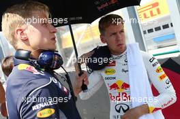 Sebastian Vettel (GER) Red Bull Racing with Heikki Huovinen (FIN) Personal Trainer on the grid. 28.07.2013. Formula 1 World Championship, Rd 10, Hungarian Grand Prix, Budapest, Hungary, Race Day